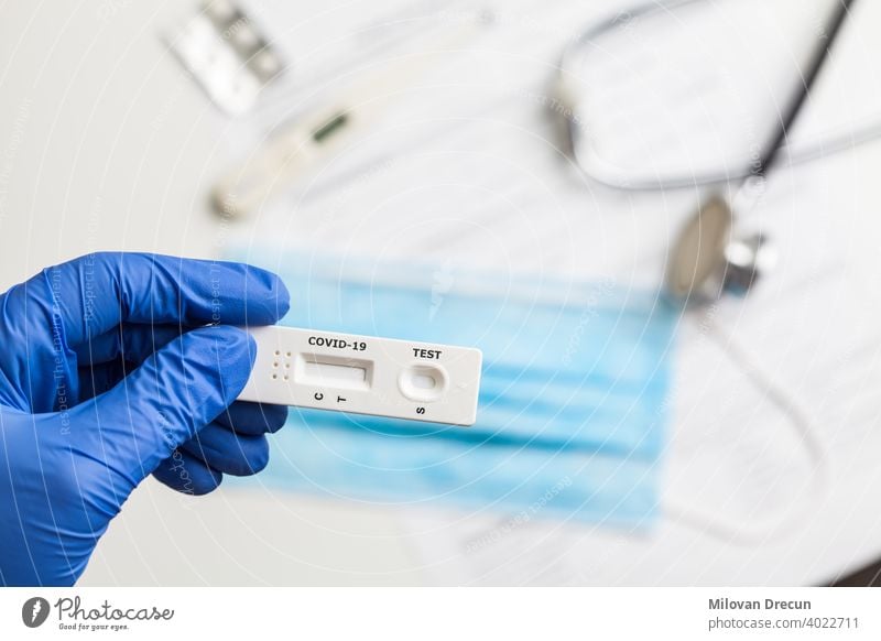 Doctor holding serological COVID-19 test 2019-ncov analyzing blood care contagion contagious control corona coronavirus covid-19 crisis diagnostic disease