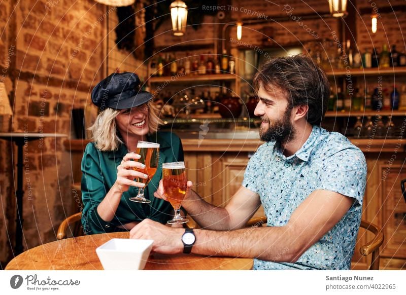 Caucasian couple having a drink at a bar. adult woman people happy female restaurant lifestyle two caucasian beautiful happiness together smile boyfriend