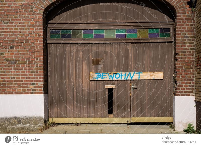 Gate of a farm in Manheim near the Hambach open-cast mine which is to be destroyed and dredged by RWE, with the notice that the building is still inhabited. Most of the houses in the village have already been demolished.