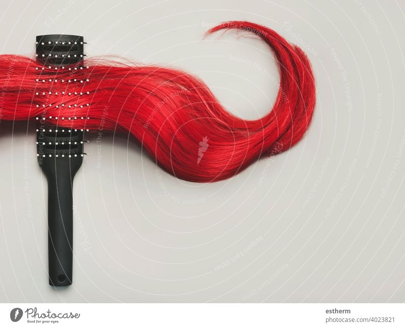 hairbrush with lock of female red hair.Hairdresser salon and hairstyles concept hairdresser salon haircut extension hairdressers hair salon accessories dryer