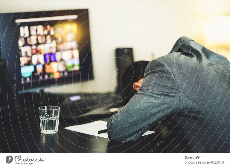 exhausted man at work in front of the computer / screen tired Exhaustion home office Computer Screen Sleep frustrated Overwork meeting conference Workplace