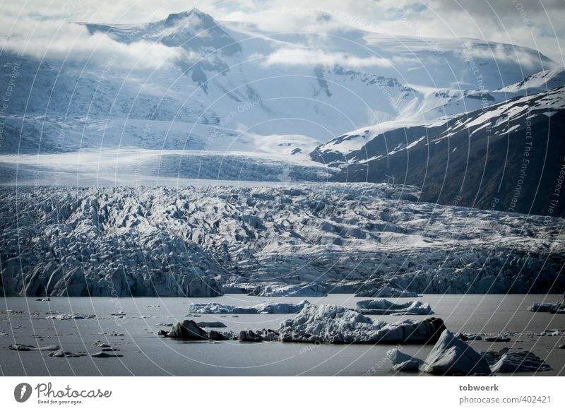 Ice, Clouds & Water Nature Landscape Elements Frost Rock Mountain Snowcapped peak Glacier Lakeside Blue Black White Impressive epic Colour photo Exterior shot