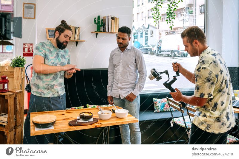 Cook explaining during the recording of a cooking workshop video camera stabilizer cooking tutorial healthy breakfast streaming live social media blogging