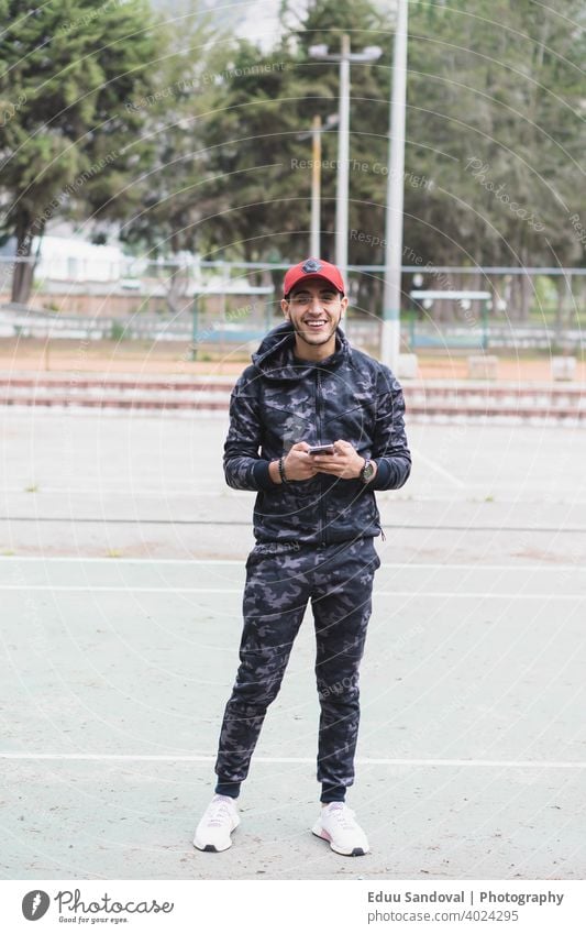 Young man exercising in the park. fitness activity athlete motivation training sport track muscular relaxation lifestyle closeup footpath recreational motion