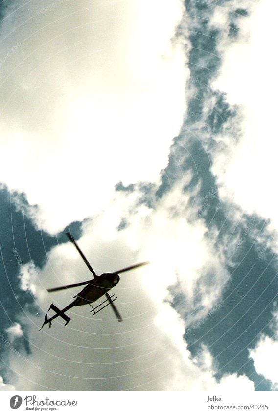 helicopters Aviation Sky Clouds Helicopter Aircraft Movement Colour photo Deserted Copy Space top Contrast Back-light