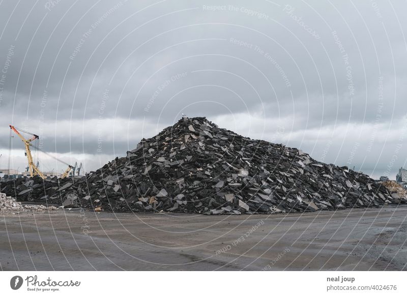 Pile of rubble on an industrial wasteland, which a single seagull uses as a vantage point Industry Fallow land Harbour Dockside crane Hill Heap Gravel stones