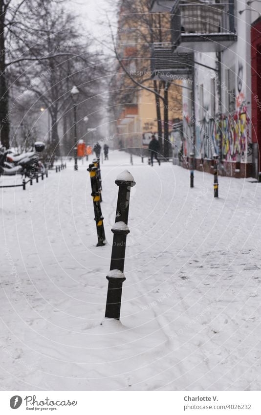 Berlin in Winter Snow Bollard Town Graffiti snowy street photography steep Street Scene Cold winter White chill Snowscape Snow layer Exterior shot Winter mood