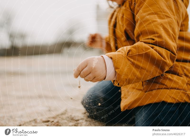 Child playing with sand Sand outdoors Close-up childhood Authentic Life Lifestyle Leisure and hobbies Colour photo Day Nature Playing Childhood memory