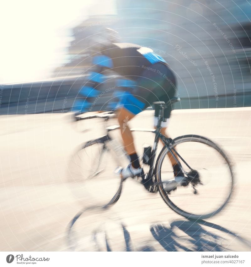 cyclist training on the street in Bilbao city, Spain biker bicycle transportation cycling biking exercise ride speed fast blur blurred motion movement defocused