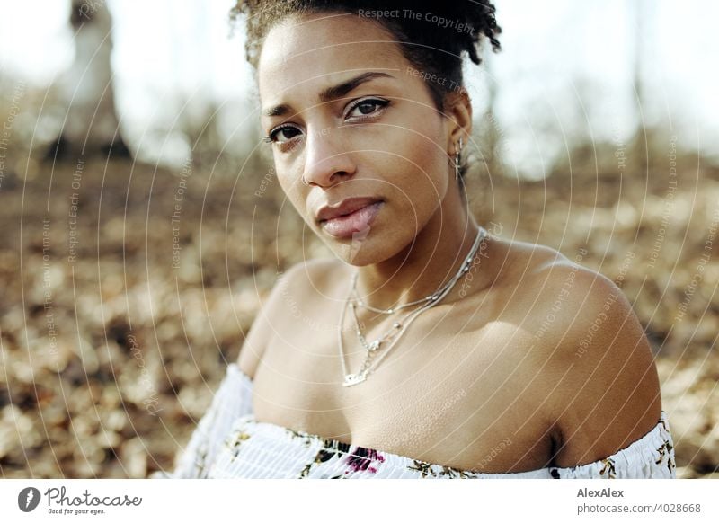 Young woman in summer dress in nature Woman Athletic Dark-haired Long-haired pretty Strong Graceful naturally Curly Slim Nature by Jewellery Chain Assecoires