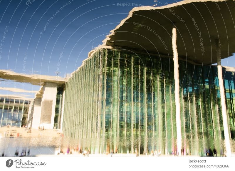 Spreebogen reflects high house Marie-Elisabeth-Lüders-House Modern architecture Surface of water Reflection Capital city Berlin Germany hazy sunshine Sky