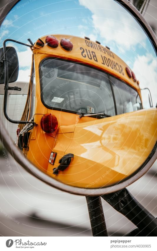 School bus photographed in exterior mirror high school school bus Yellow Retro Old-school Seventies Bus Bus travel The eighties Sixties Mirror Mirror image