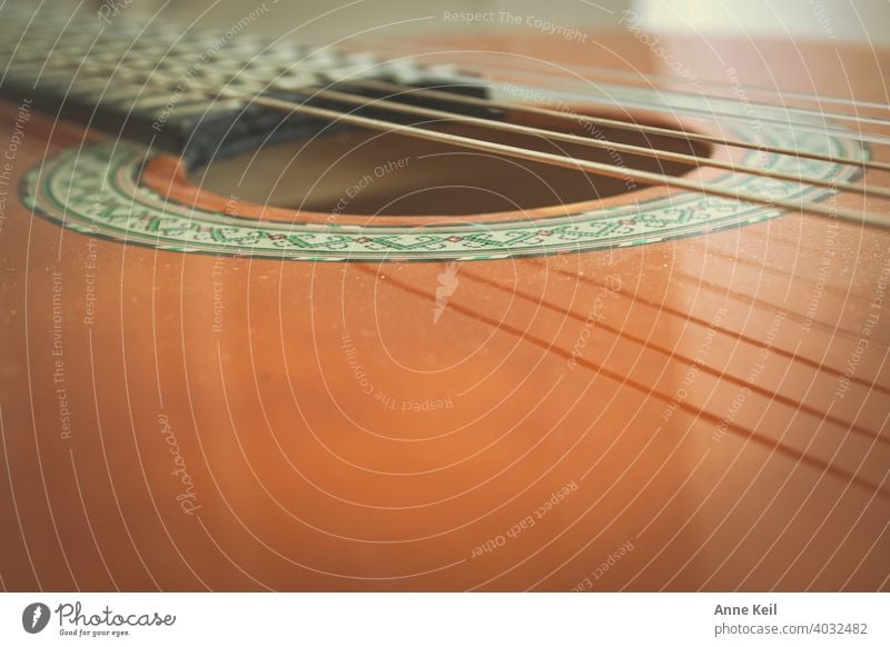 Part of a guitar. Guitar Music Musical instrument Musical instrument string Leisure and hobbies Make music Wood Sound String instrument Musician Close-up