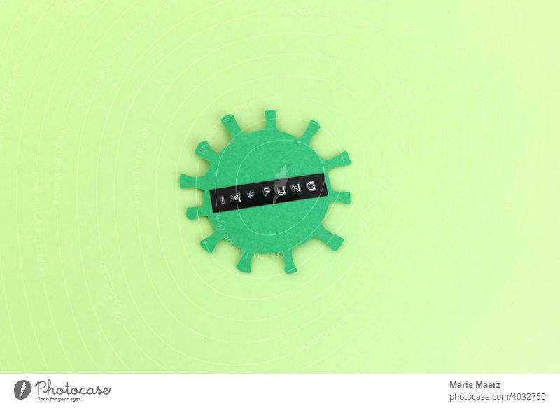 Corona vaccination | Corona virus Symbol made of paper with the word vaccination written on it corona coronavirus Immunization pandemic Compulsory vaccination