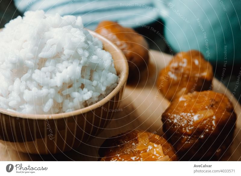 Close up of a plate of food composed with rice and meatballs over a wooden table cookery oriental protein color image lebanon almonds holding prepare sweden