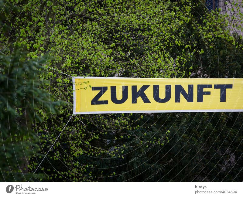 Future, inscription, word, concept on a banner in front of leafy trees. in future Word lettering transparent uncertainty Fashioned Climate change Development