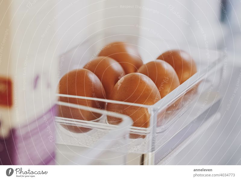 fresh eggs in refrigerator, dairy product authentic box breakfast brown carton chicken cinematic closeup cooking copyspace diet easter farm food fridge healthy