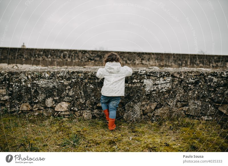 Rear view child looking through walls Child childhood Caucasian 1 - 3 years Colour photo Copy Space Infancy Human being Lifestyle Toddler Joy