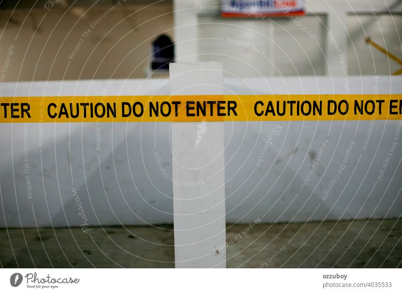 the caution do not enter yellow black line sign attention danger crime tape warning criminal barricade barrier construction scene restricted safety security law