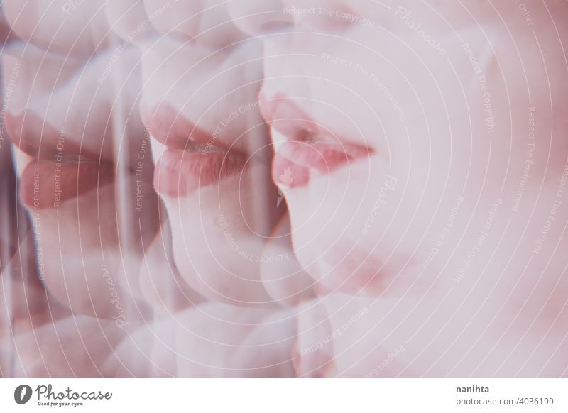 Distorted image of a young woman face view througn a prism beauty abstract lips makeup make up reflection reflected distortion distorted blur blurry focus