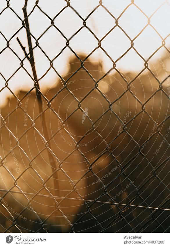 Fence during a colorful sunset background, orange and green tones fence sky nature landscape beautiful light farm evening silhouette outdoor summer sunrise