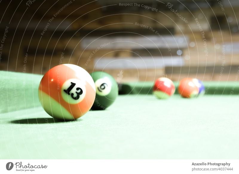 Billianrs balls on a green table action aiming background billiard billiards black break champion championship color colored colorful competition competitive