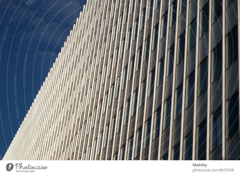 High-rise building of the Goethe University in front of a blue sky at sunshine in Frankfurt am Main Bockenheim in Hesse Facade skyscrapers university