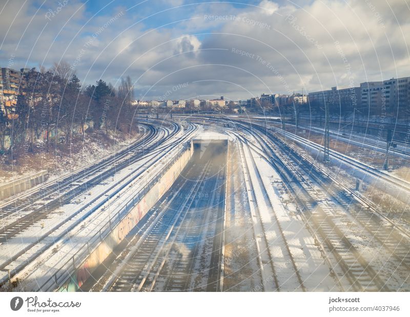 Northern cross with lots of clouds and snow North Cross Airy Railroad system Winter's day Snow Traffic infrastructure Clouds Sky Double exposure Railroad tracks