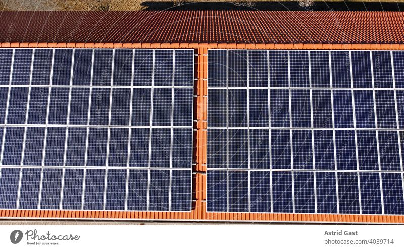 Aerial photograph with a drone of a photovoltaic system on the roof of a house solar Solar system photovoltaics Roof house roof panels Energy Force Electricity