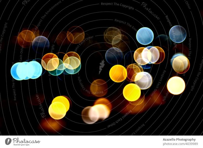 Black background with vivid colorful bokeh circles abstract blur blurred blurry bright celebration christmas colour dark decoration defocused design dot effect