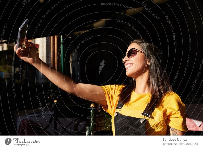 Teenager girl taking selfie at cafeteria. madrid young lifestyle beautiful fun happy leisure woman smiling teen cheerful female youth city pretty outdoors