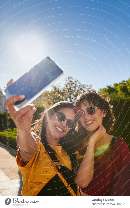 Two teenager girls taking a selfie. madrid young people friendship lifestyle beautiful fun happy together leisure woman smiling teens cheerful female youth