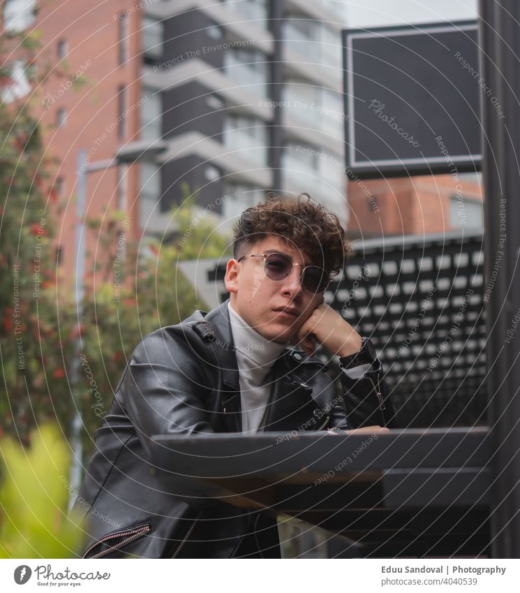 Young man spending some quality time around the city. fashionable photogenic suit face background studio hair posing elegant adult portrait caucasian person