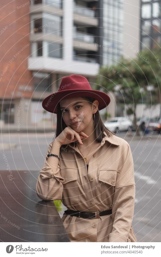 Young girl enjoying a nice afternoon in the city. casual attire drinking beautiful woman hot drink cup female portrait caucasian attractive computer smile