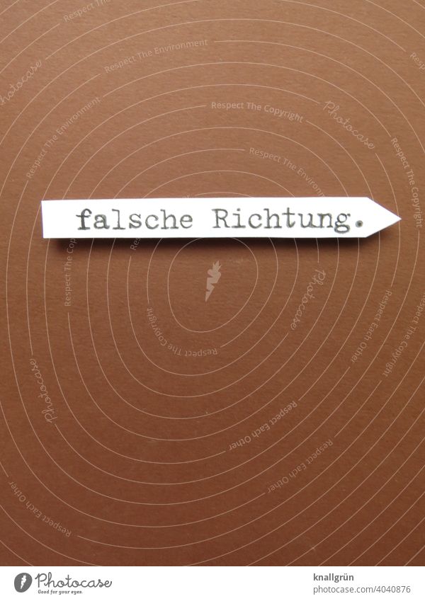 in the wrong direction. Direction Signs and labeling Orientation Lanes & trails Arrow Road marking Navigation Clue Signage Recommendation Right Copy Space