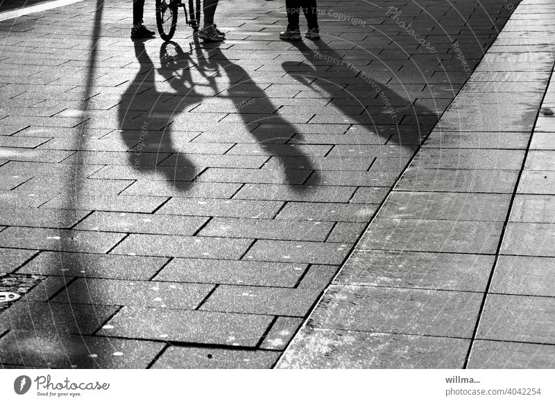 Encounters - when two meet a third Shadow people 3 communication meetings chat Group Pedestrian Places Pedestrian precinct Legs Bicycle maintain entertainment