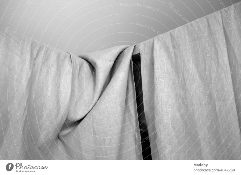 Linen cloth on a line as a curtain in a designer apartment in a farmhouse in Rottenbuch in the district of Weilheim-Schongau in Upper Bavaria, photographed in classic black and white