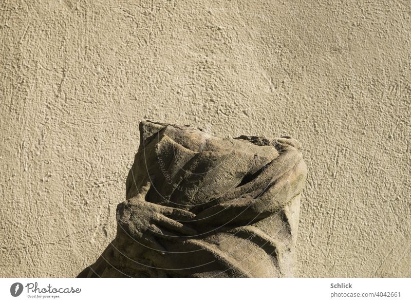 Headless, portrait of a statue of a saint made of sandstone without head Statue Sandstone chest picture Sidelight Hand statue of saints decapitated Vandalism