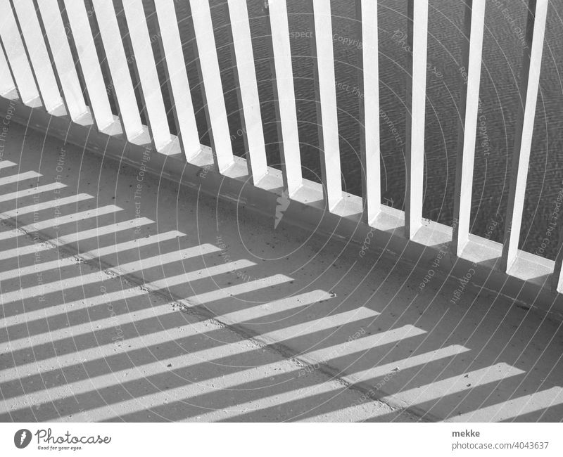 Bridge railing in the spring sun Shadow Architecture Steel construction Iron walkable Unafraid of heights Water Metal Town Sun Sunlight Pattern Stripe Concrete