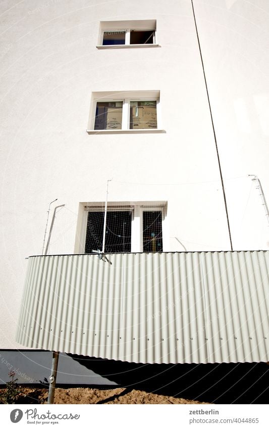 Inner city living with balcony Old building on the outside Fire wall Facade Window House (Residential Structure) Sky Sky blue rear building Backyard Courtyard