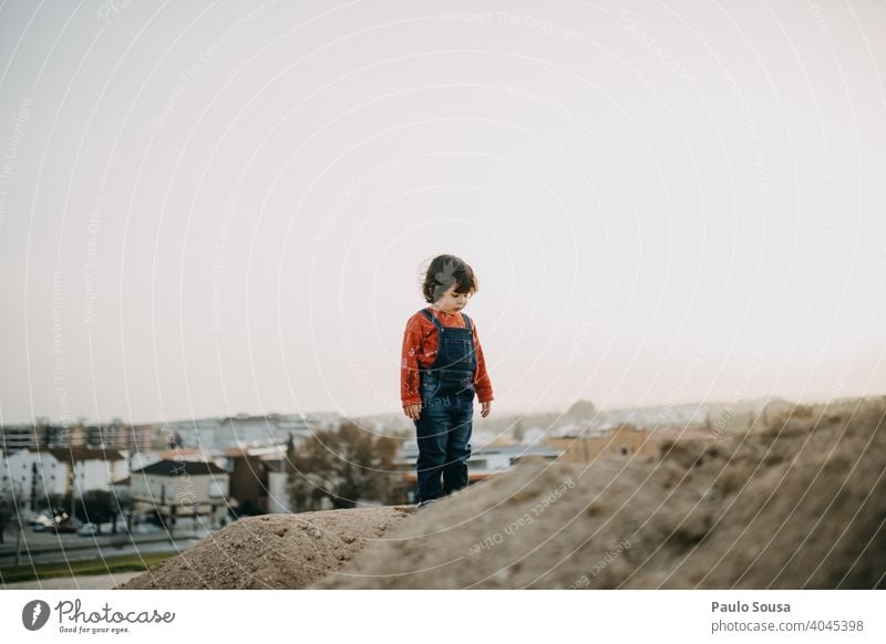 Child playing outdoors with sand childhood explore Girl 1 - 3 years Childhood memory Nature Day Joy Human being Exterior shot Playing Toddler Colour photo