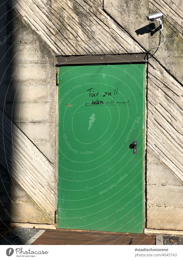 Camera monitored door with lettering Parking garage on the outside Door closed Deserted Architecture camera Surveillance Exterior shot Entrance Building