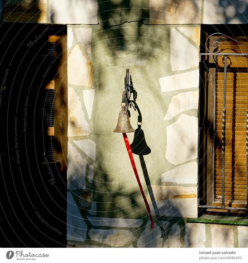 bell on the wall of the house metallic shadows door window House (Residential Structure) Wall (building) Colour photo Facade Deserted Exterior shot Architecture