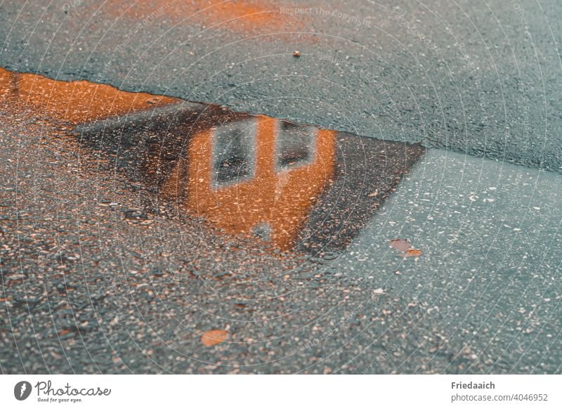 Reflection of a house in the puddle on the asphalt Reflection in the water Asphalt Street House (Residential Structure) Puddle puddle mirroring Wet Rain walk