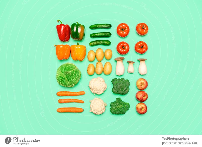 Vegetables and fruits symmetry, isolated on a colored background, top view. Healthy food concept above view aligned apples assorted autumn boletus edulis