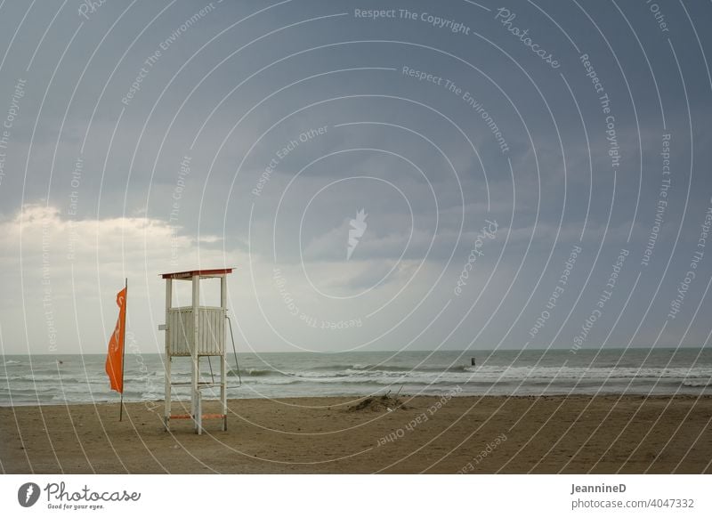 Autumn atmosphere, empty beach with lifeguard house at the sea with rain clouds Beach rainy day Empty Italy Deserted Bad weather Exterior shot Wet Rain Rimini