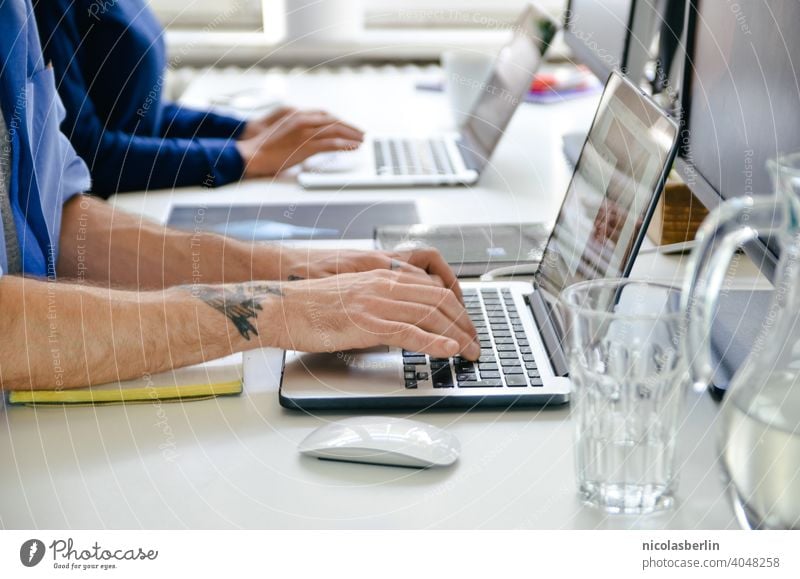 Cutout hands of employees working on laptop in office Sit Notebook Modern Work area Desk Cyberspace desktop Employees &amp; Colleagues Workplace Keyboard