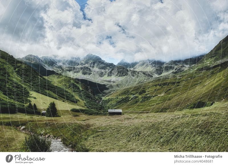 Landscape in the Austrian Alps Serfaus Fiss-Ladis mountains valleys wooden huts Mountain huts Nature Fog wafts of mist Grass Meadow Willow tree Rock Tourism