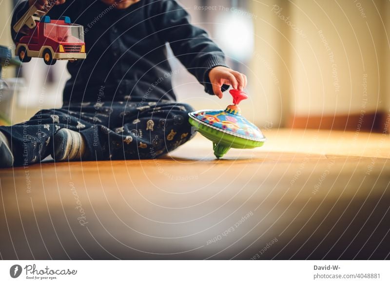 child playing on the floor at home Playing Child fun Toys explore Joy childcare Infancy Cute Happy Children's room Contentment Employment Gyroscope