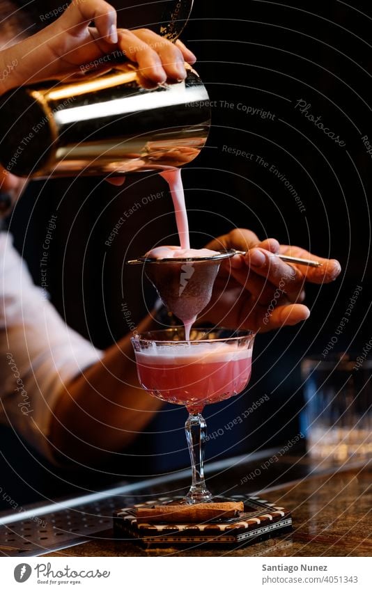 Barman is making cocktail at night club. bartender nightclub pub beverage liquor barman alcohol drink party restaurant professional nightlife preparation shaker